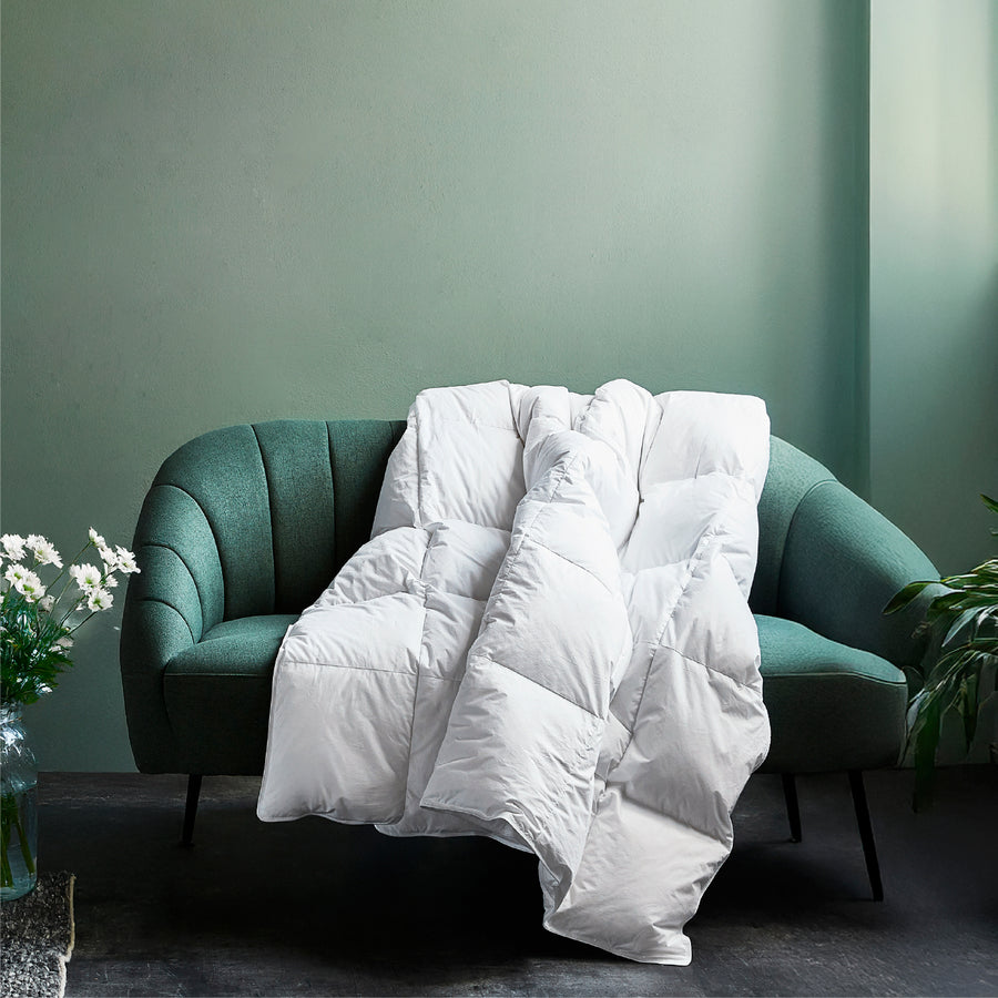 Plush goose down duvet on a bed
